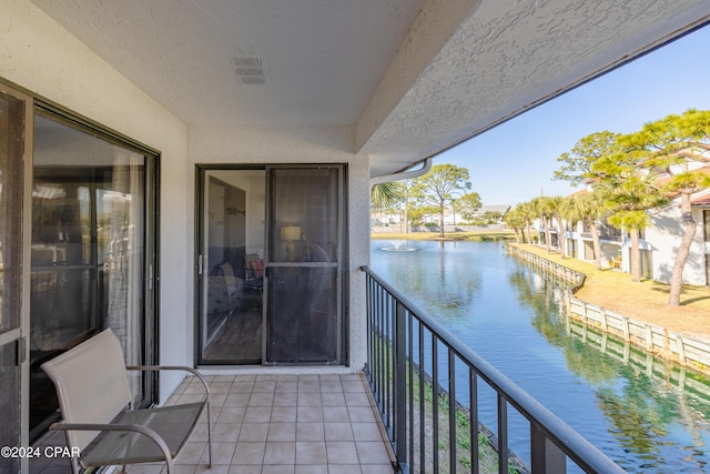 balcony featuring a water view