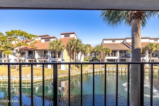 balcony featuring a water view