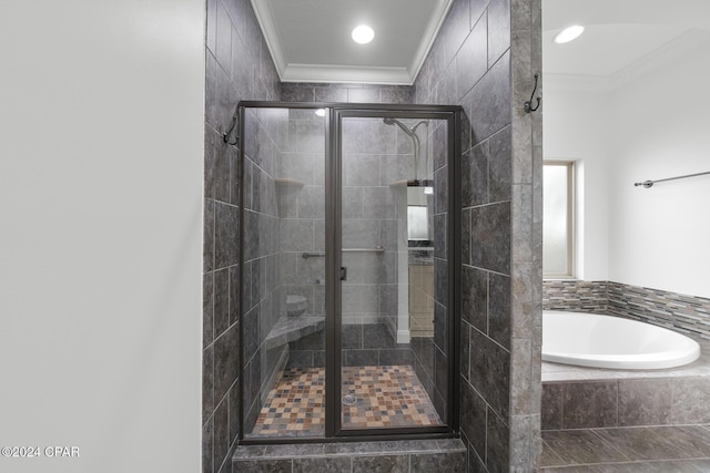 bathroom featuring shower with separate bathtub and ornamental molding