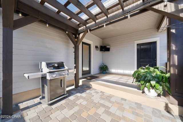 view of patio with a pergola and grilling area