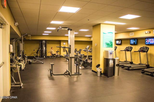 gym with a drop ceiling and visible vents