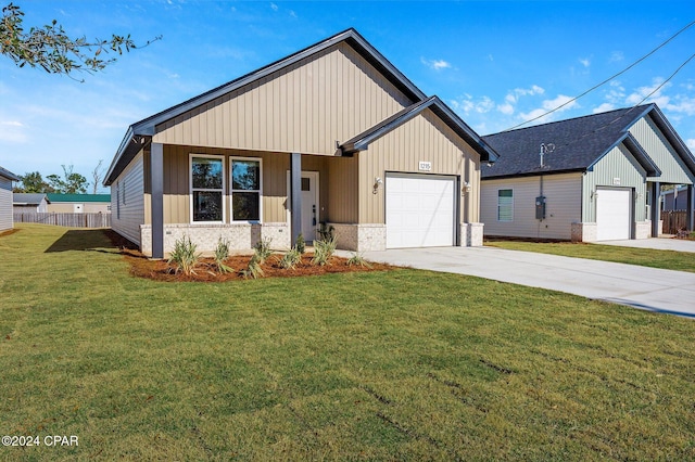 modern farmhouse style home featuring fence, board and batten siding, concrete driveway, an attached garage, and a front yard