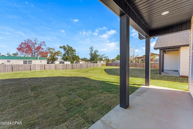 view of yard with a patio and fence