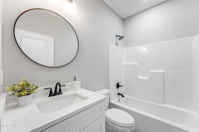 bathroom featuring vanity, shower / tub combination, and toilet