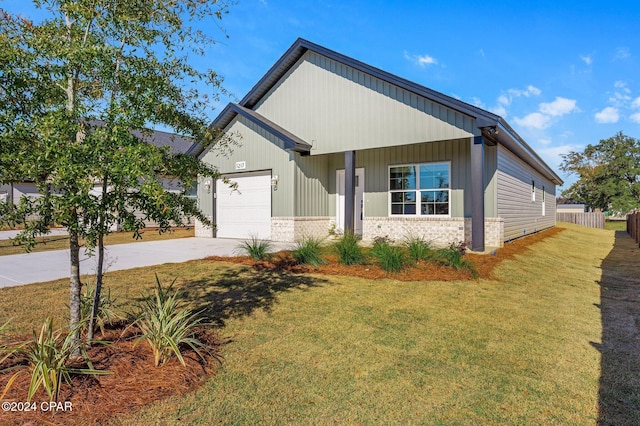 view of front facade featuring concrete driveway, an attached garage, brick siding, and a front lawn