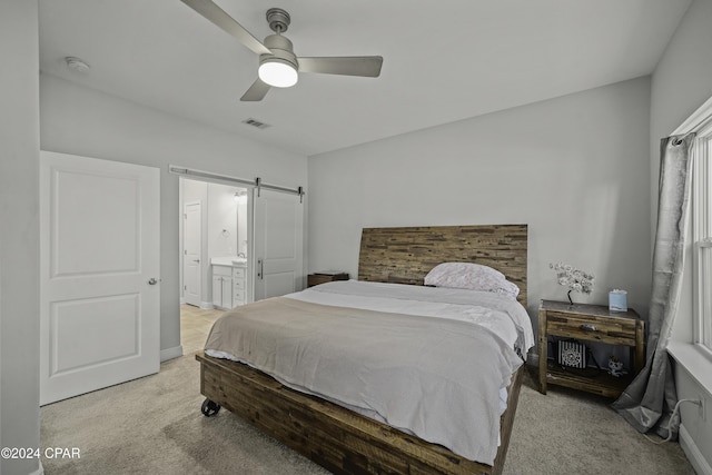 carpeted bedroom featuring connected bathroom and ceiling fan