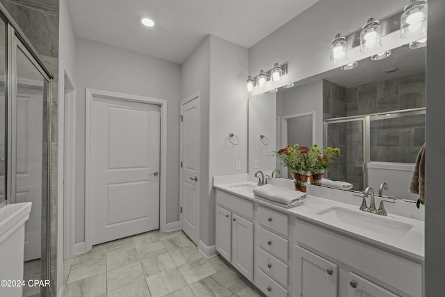 bathroom featuring vanity and an enclosed shower