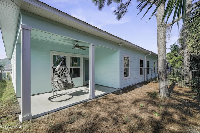 back of property with a patio, central AC unit, and ceiling fan