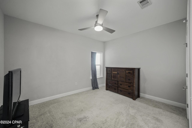 bedroom featuring ceiling fan and light colored carpet