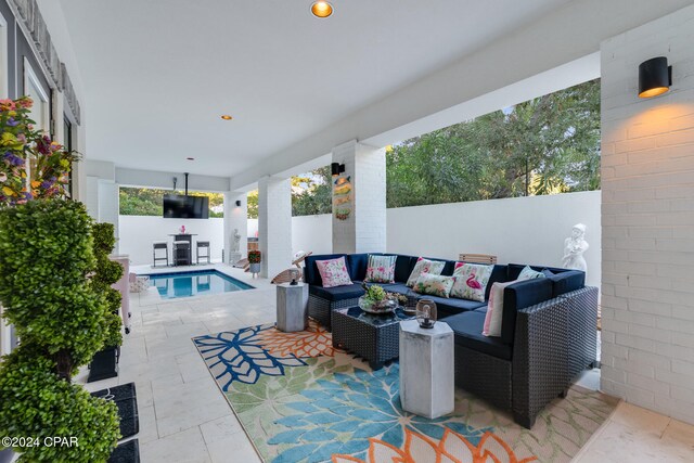 view of patio / terrace with a fenced in pool and outdoor lounge area