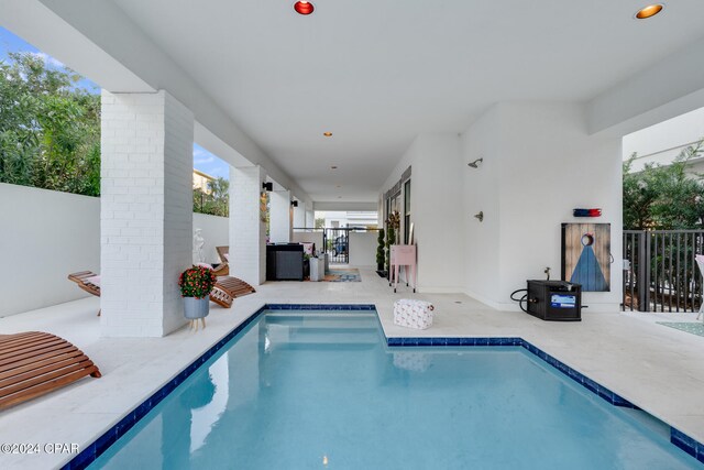 view of swimming pool with a patio