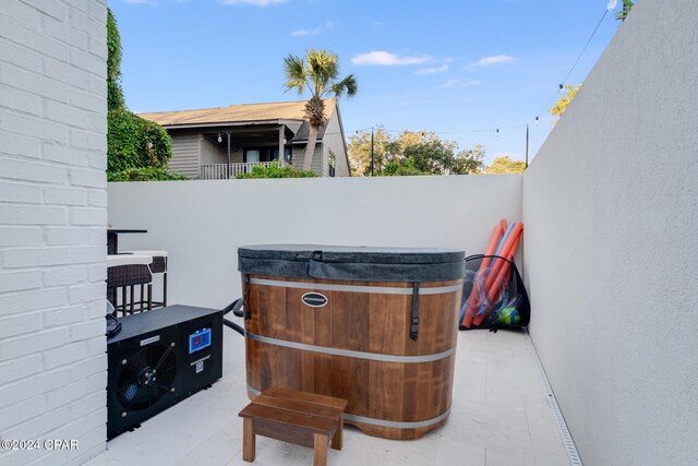 view of patio / terrace featuring a hot tub