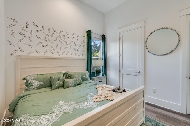 bedroom featuring dark wood-type flooring