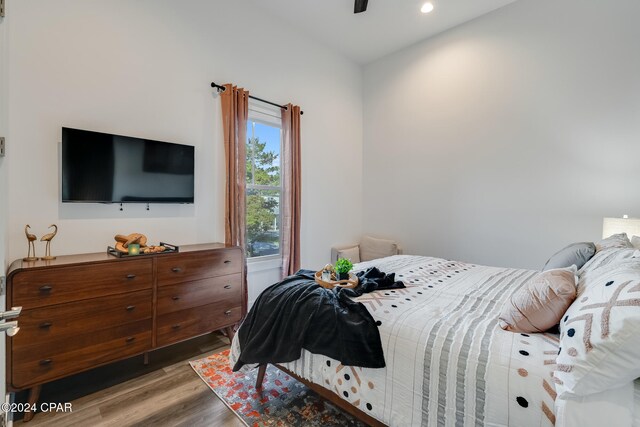 bedroom with hardwood / wood-style floors