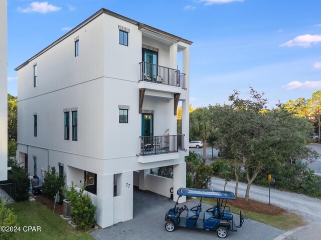 view of property exterior with a balcony