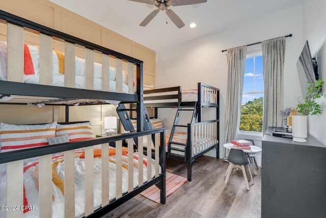 bedroom with ceiling fan and wood-type flooring