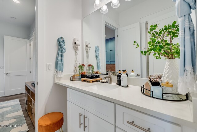 bathroom featuring vanity and hardwood / wood-style flooring