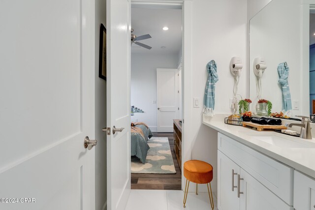 bathroom featuring tile patterned floors, ceiling fan, and vanity