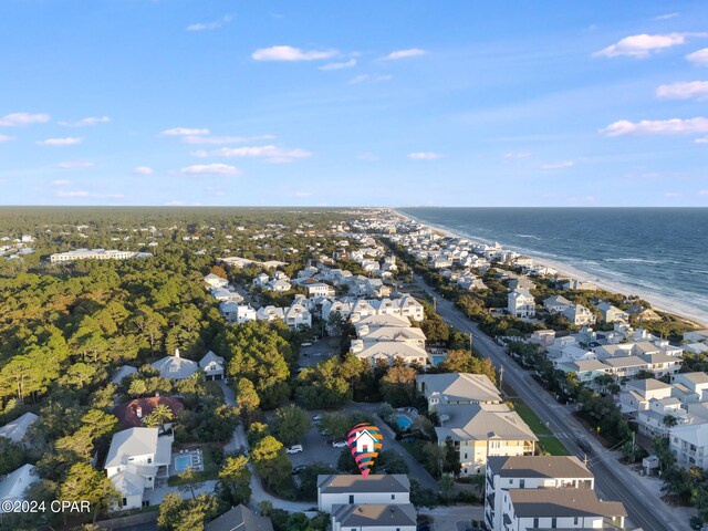 bird's eye view featuring a water view and a view of the beach