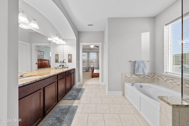 bathroom featuring a bath, vanity, tile patterned floors, and ceiling fan