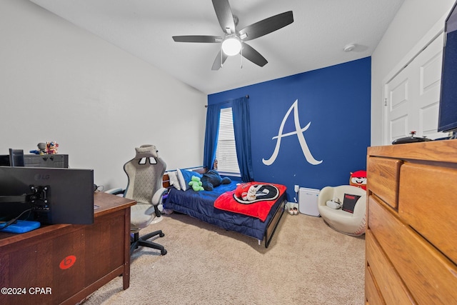 bedroom featuring carpet, vaulted ceiling, and ceiling fan