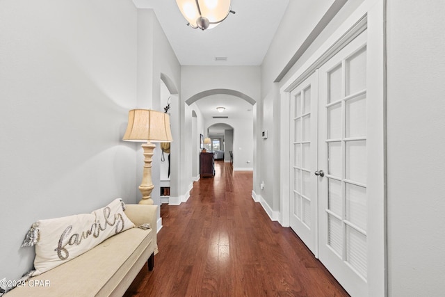 corridor featuring dark hardwood / wood-style floors