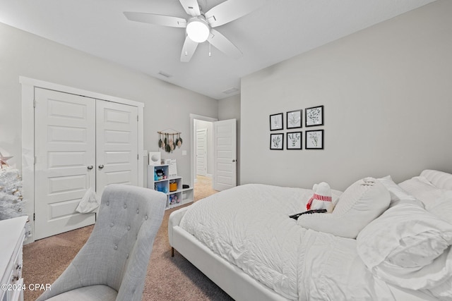 bedroom featuring ceiling fan, a closet, and carpet