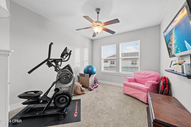 exercise room featuring carpet flooring and ceiling fan