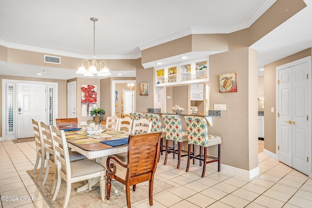 tiled dining room with crown molding and a notable chandelier