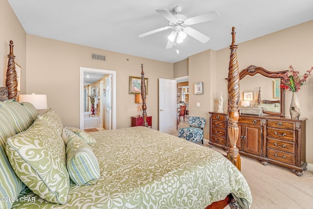 carpeted bedroom featuring ensuite bathroom and ceiling fan