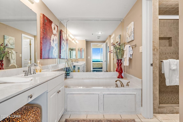 bathroom featuring separate shower and tub, tile patterned flooring, and vanity