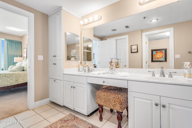 bathroom featuring tile patterned flooring and vanity