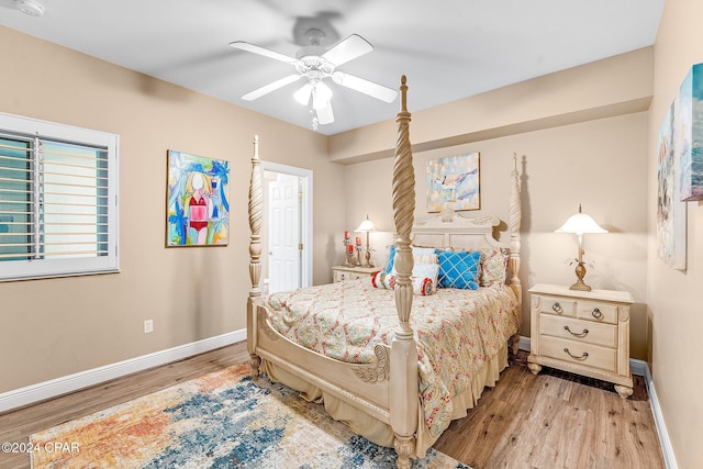 bedroom with ceiling fan and light hardwood / wood-style floors