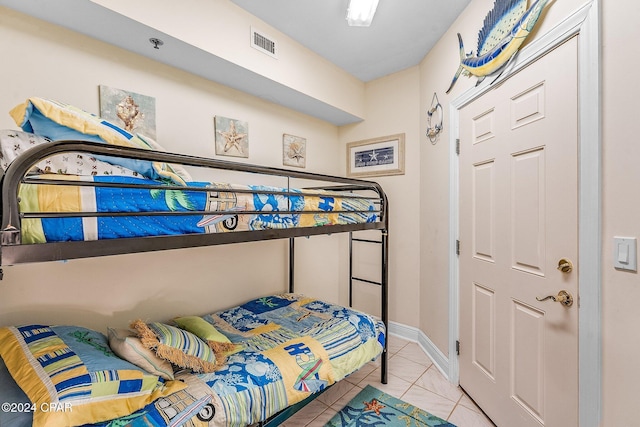 bedroom with light tile patterned flooring