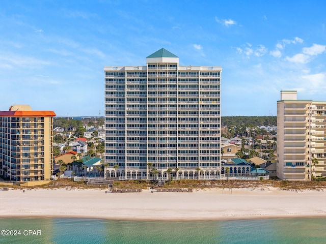 exterior space featuring a view of the beach and a water view