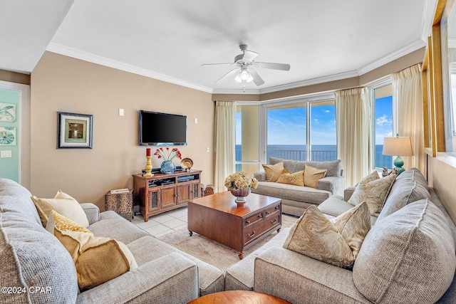 tiled living room with ceiling fan and ornamental molding