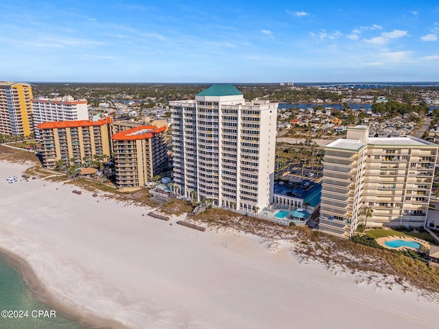 drone / aerial view with a view of the beach and a water view