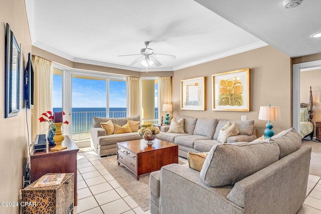 tiled living room with a water view, ceiling fan, and crown molding