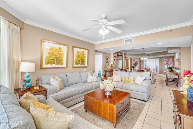 living room featuring ceiling fan, light tile patterned floors, and ornamental molding