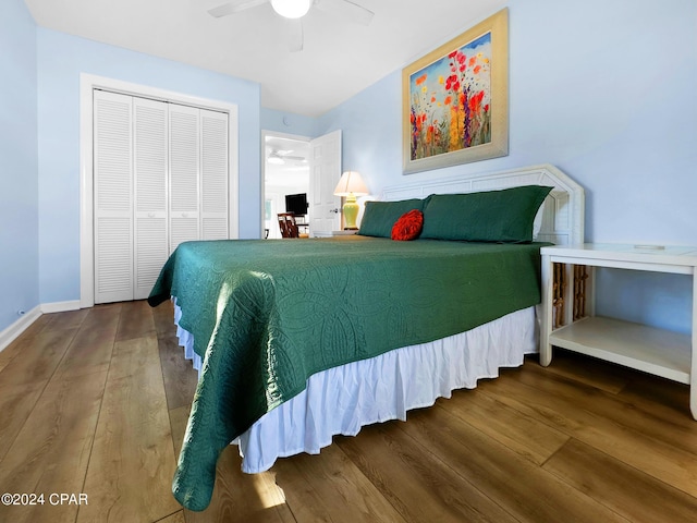 bedroom with ceiling fan, a closet, baseboards, and wood finished floors