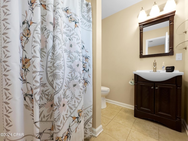 full bathroom with tile patterned flooring, curtained shower, baseboards, toilet, and vanity