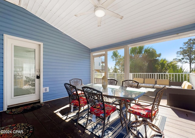 sunroom / solarium featuring ceiling fan and vaulted ceiling