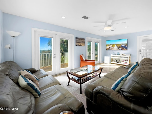 living room with a ceiling fan, wood finished floors, visible vents, recessed lighting, and french doors