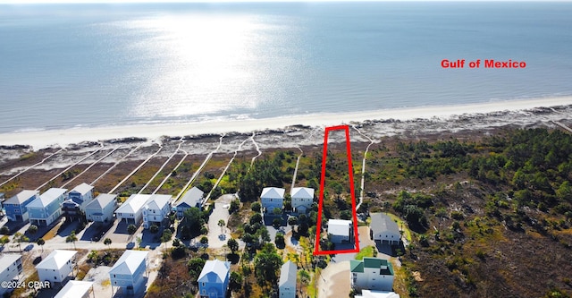 aerial view featuring a residential view, a beach view, and a water view