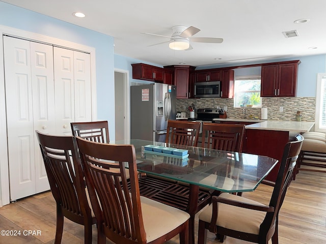 dining room with recessed lighting, visible vents, light wood-style floors, and ceiling fan