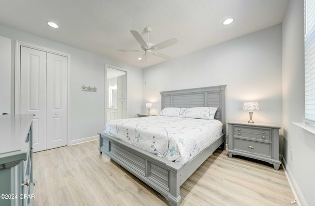 bedroom with ceiling fan, light hardwood / wood-style flooring, and a closet