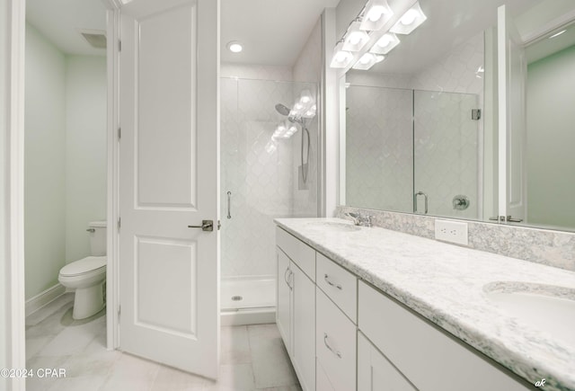 bathroom featuring tile patterned floors, vanity, toilet, and an enclosed shower