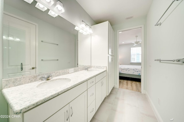 bathroom featuring vanity and ceiling fan