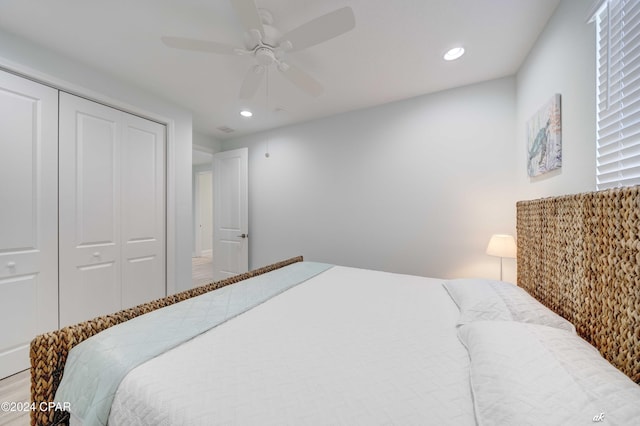 bedroom with ceiling fan and a closet