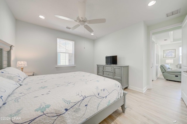 bedroom featuring light hardwood / wood-style flooring and ceiling fan